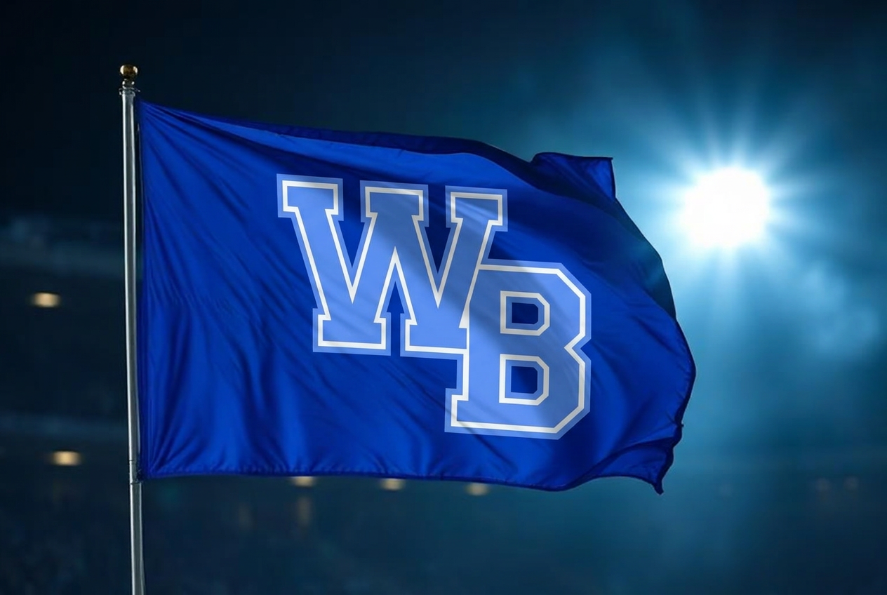 WB flag waving under stadium lights